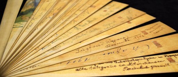 This fan is memorabilia from the Bayreuth Festival (1901). It contains the autographs of Cosima and Siegfried Wagner as well as those of several major and minor performers, conductors, directors and managers, and notable attendees. [Bayreuth Fans, Fan 1]
