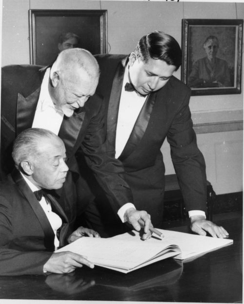 ESPA 4x5 negative box 1-2 without borders William Grant Still (seated) with fellow composers Howard Hanson (1896-1981) and Louis Ballard (1931-2007), photographed in later years at the Eastman School, most likely during the 1968 Festival of American Music, when Hanson conducted Mr. Still’s orchestral composition The Little Song That Wanted to be a Symphony. Photo lacking attribution. Eastman School Photo Archive.