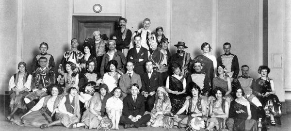 The Rochester American Opera Company, ESM’s first opera group, as the cast of Bizet’s Carmen (1925). Photograph from ESPA 13/18 (8x10). 32 students, wearing costumes for the opera Carmen, pose as a group with four men wearing suits and ties.