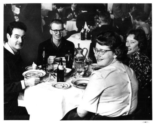 ESPA 8x10 box 7-5 Four Philharmonia members at table. From left to right, harpist Robert Barlow, BM ’61; violist Albert Filosa, BM ’64; violinist Jacqueline Masters, BM ’63; and violinist Margaret Harnish, BM ’63, MM ’64.