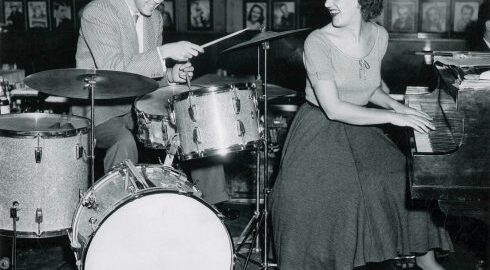 The Marian McPartland Collection includes a large series of photographs from McPartland’s professional career, including this photograph of Joe Morello and Marian McPartland performing at the Hickory House in NYC (ca. 1950s), which was taken by the prolific New York-based entertainment photographer William “PoPsie” Randolph. [Marian McPartland Collection, Box 26, Folder 4, Sleeve 5]