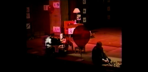 Part I at 29-05 having moved the chair aside, performer begins to lower himself