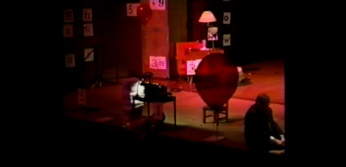 Part I at 29-10 having moved the chair aside, performer begins to lower himself