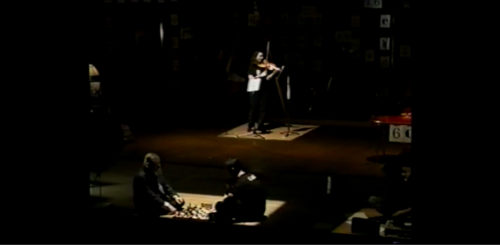 Part I at 32-15 super-impositions: five sets of performers on-stage; at least two vocal Solos happening