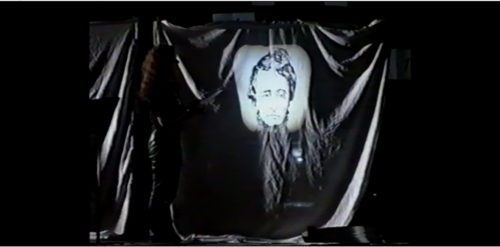 Part I at 36-15 slide of Thoreau’s likeness projected onto sheet (this a defined Solo in itself)