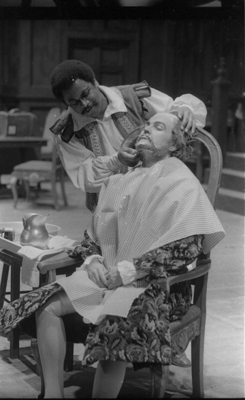 R1063-7 In act I of Die Schweigsame Frau, retired naval admiral Sir Blunt Morosus (Alexander Stephens, BM ’71, MM ’72) is attended to by his barber, Pancreas Cutbeard (Joseph Bias, MM ’72).