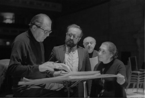 R1393-25 Conductor Walter Hendl, composer Krystof Penderecki, and soloist Felicja Blumental conferring over the score in the Eastman Theater. Ms. Blumental’s husband Markus Mizne is seen in the background in several of these shots.