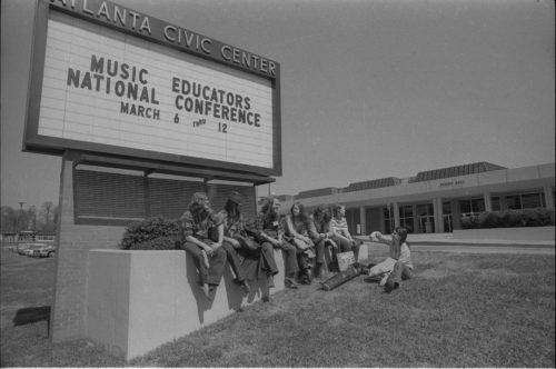 Photographer Louis Ouzer accompanied the Eastman musicians on their three-city tour. These shots capture ensemble members and their directors in candid moments during travel.