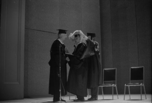 Conferral of the honorary Doctor of Music degree on guest artist Rudolf Serkin. UR President W. Allen Wallis presides; Director Walter Hendl presents the degree and reads the citation; and Assistant Director Daniel R. Patrylak hoods the newly designated Dr. Serkin.