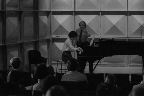 R2889-33 John Perry coaching an Eastman piano major on-stage in Howard Hanson Hall.