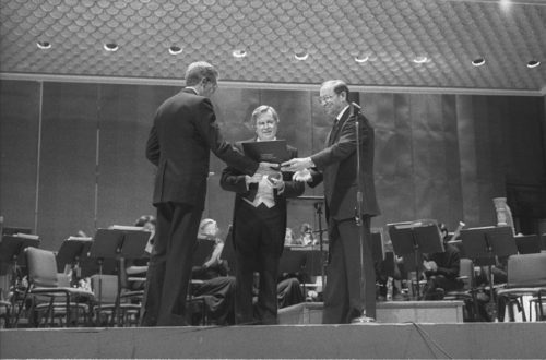 R4037-5 Dr. Donald Hunsberger, conductor of the Eastman Wind Ensemble since 1964, is presented with the National Band Association Academy of Wind and Percussive Arts Society Award by Edward Lisk, President of the NBA.