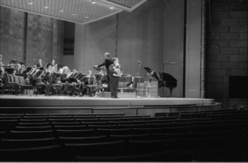 R4041-20 The Eastman Wind Ensemble on-stage in the Eastman Theater: first under Frederick Fennell, and then under Donald Hunsberger, with tuba soloist Toru Miura.