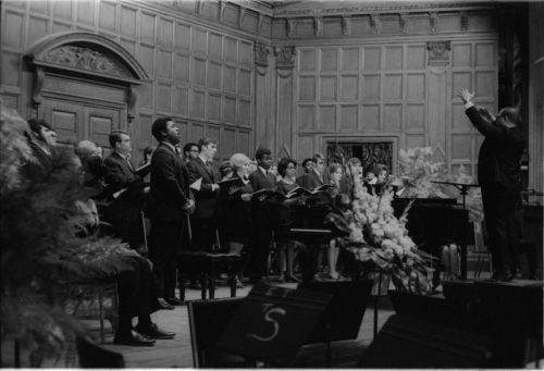 R582-17 Members of the Eastman Chorale on-stage in Kilbourn Hall, conducted by Professor Milford Fargo. In the first two shots, baritone Joseph Bias (not holding a score) is the soloist.