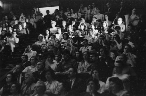 R583-15A Two shots of audience members in Kilbourn Hall during the memorial service. Students, faculty members, and local citizens were all gathered together.