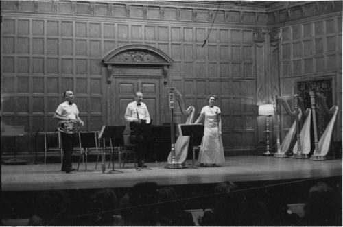 R691-12A Eastman School faculty members Verne Reynolds, Robert Sprenkle and Eileen Malone on-stage in Kilbourn Hall on the occasion of the premiere performance of Alec Wilder’s Suite for Harp, Oboe and French Horn, June 28th, 1969, at the 6th national conference of the American Harp Society.
