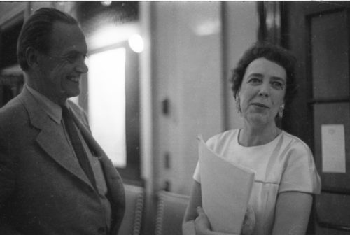 R691-15A Composer Alec Wilder and harpist Eileen Malone in conversation in the Eastman School’s Main Hall (today Lowry Hall) during the AHS 6th national conference, June, 1969.