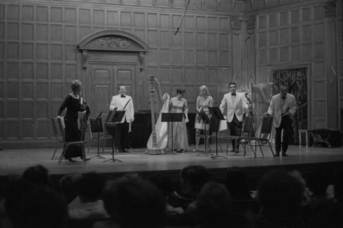 R691-7A Performers on-stage in Kilbourn Hall for Images by Wayne Barlow, June 28th, 1969. Harpist Suzanne Thomas is assisted by strings players Carroll Glenn, Anastasia Jempelis, Francis Tursi, and Alan Harris and clarinettist Stanley Hasty. American Harp Society 6th national conference.