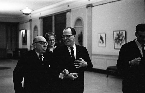 On the evening of the Eastman Philharmonia concert, Concert Manager Mr. Robert Sattler escorts composer Igor Stravinsky and his wife Vera.