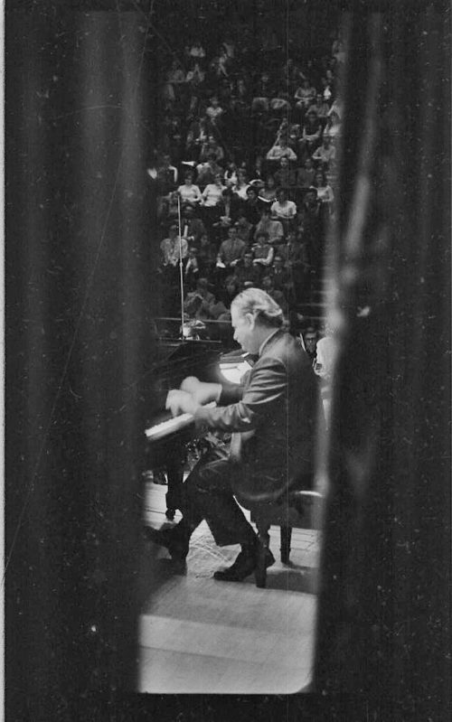 R742-18 Pianist Eugene List performing with the student orchestra, here seen from the wings.