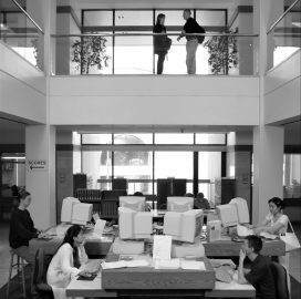 Interior view from the 2nd-floor entrance to the new Sibley Music Library, showing several students working at computers.