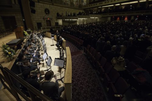 Eastman Trombone Choir, conducted by Mark Kellogg (standing) and Larry Zalkind, plays as graduates enter. // University of Rochester Eastman School of Music Commencement Ceremony, Kodak Hall at Eastman Theatre May 15, 2016. // photo by J. Adam Fenster / University of Rochester
