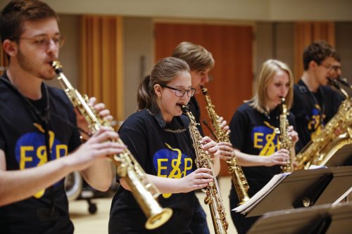 Eastman Saxophone Project Institute students Five saxophone students in dark blue t-shirts rehearsing.