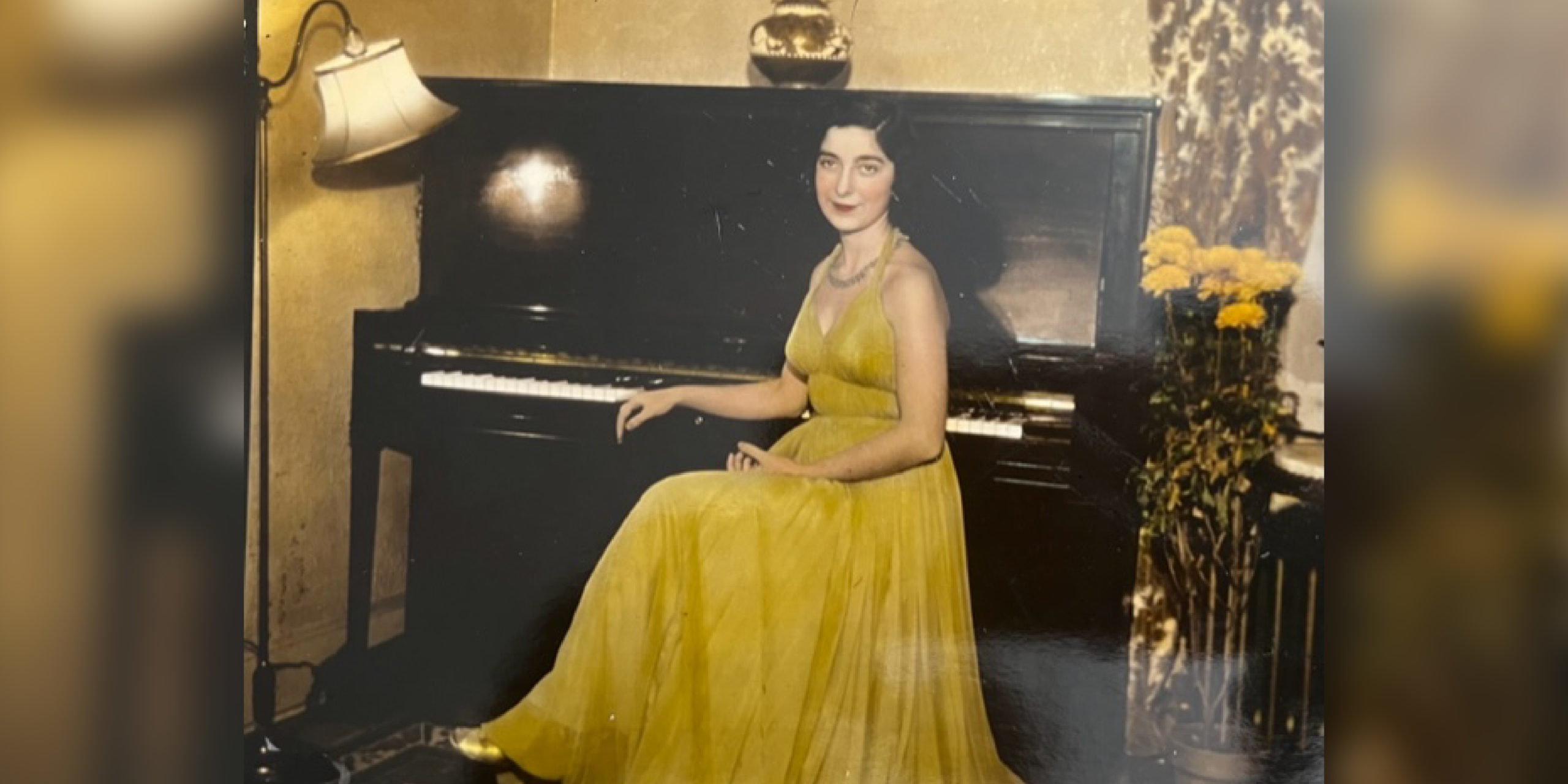 Alumna Gloria Mikialian '45E in a yellow dress at the piano. Date unknown.