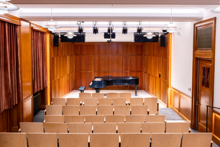 HHH Reno-multicrop Newly renovated Howard Hanson Hall, from the audience, looking at the stage and Steinway piano.