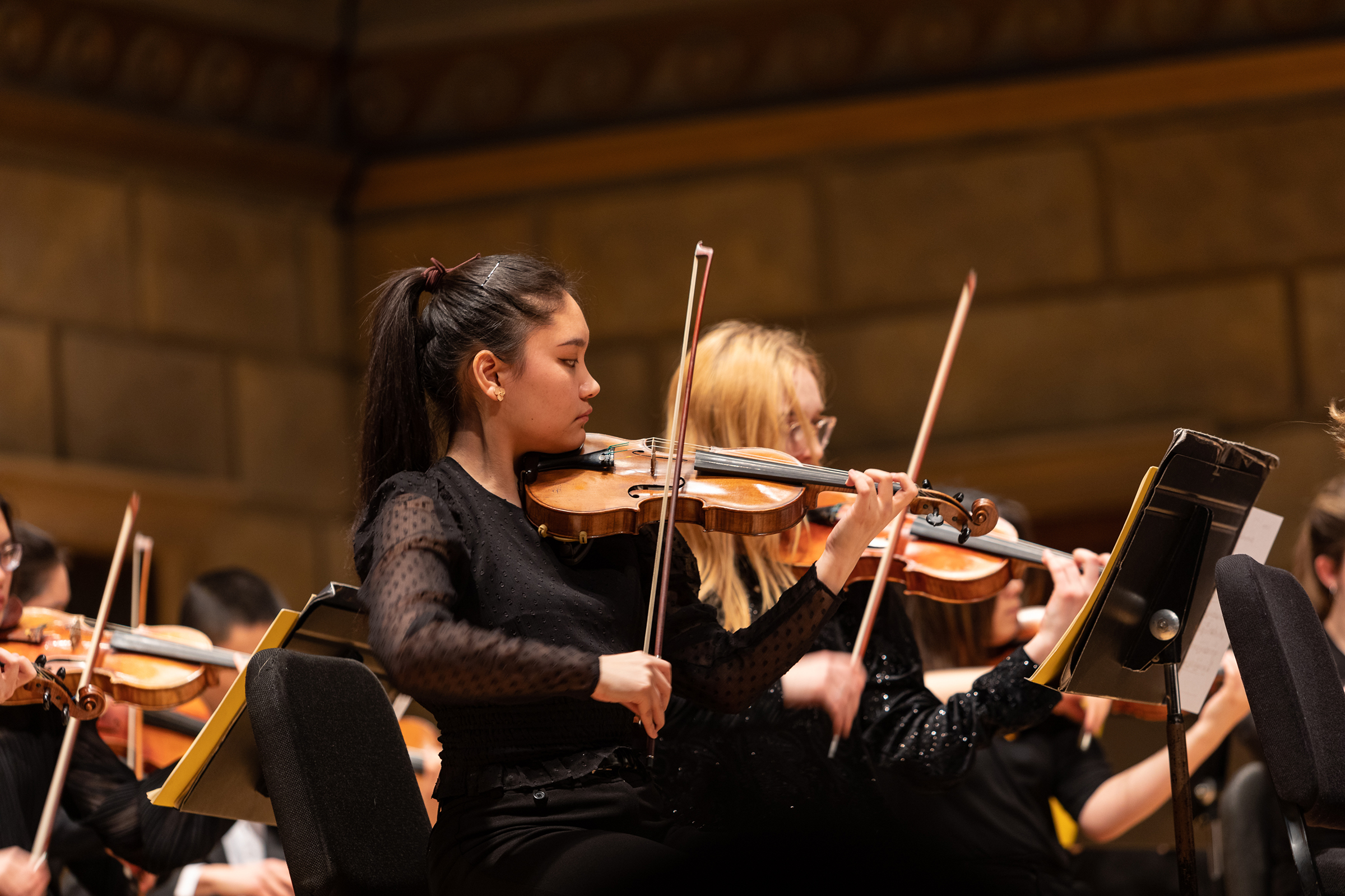 Image of two violinists performing in Kodak Hall