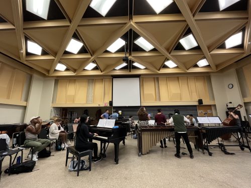 conductor Tim Long leads a rehearsal
