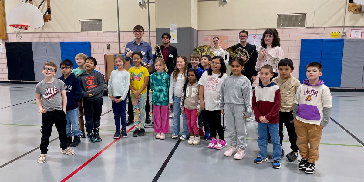 The group QuinTed pictured with a group of future musicians