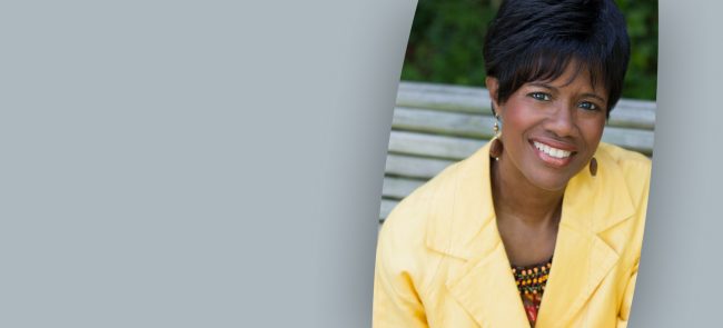 Headshot of Dr. Rosephanye Powell in a yellow suit.