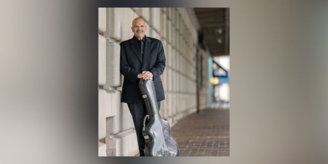 Nick Glouses in front of Eastman School of Music