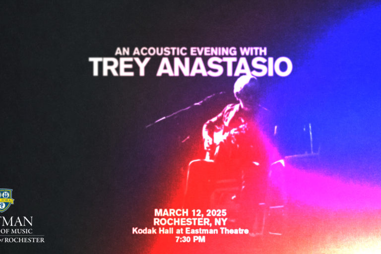 Graphic advertising "An Acoustic Evening with Trey Anastasio" with abstract image of Trey playing guitar in red and blue spotlight.