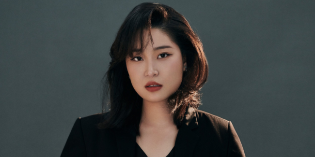 Close-up photo of woman with dark hair.