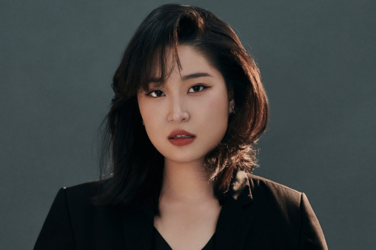 Close-up photo of woman with dark hair.