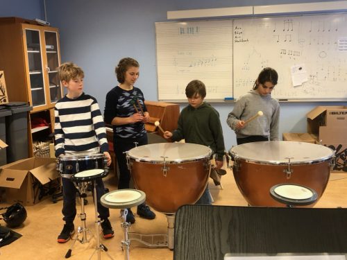 Hannah Dick teaching percussion to students in Sweden