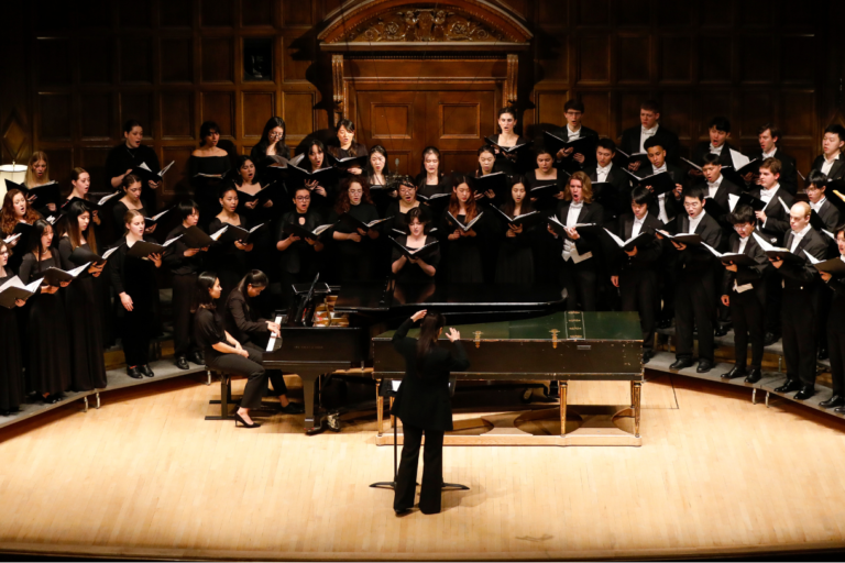 treble-chorus A choir of 50 singers in concert dress standing on risers in Kilbourn Hall